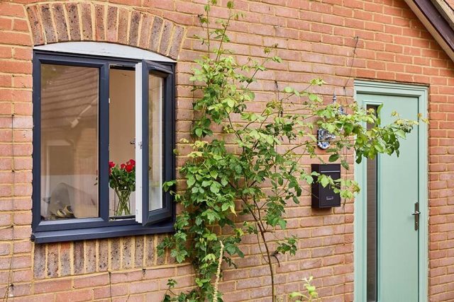 Sage Green Front Door And Dual Anthracite Grey Casement Window